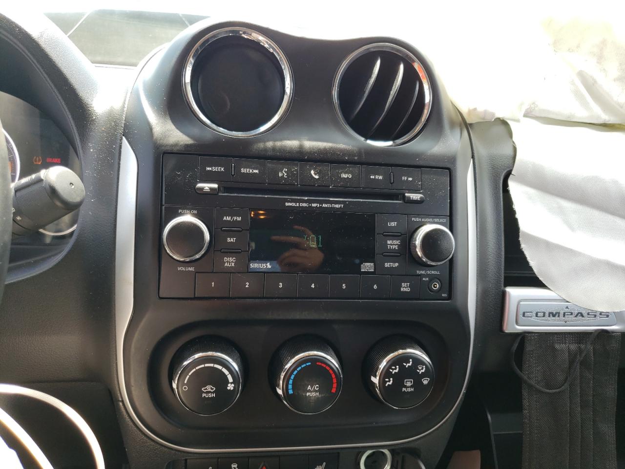 Photo 9 from auction – 2016 JEEP COMPASS LA with VIN 1C4NJCEA8GD614951