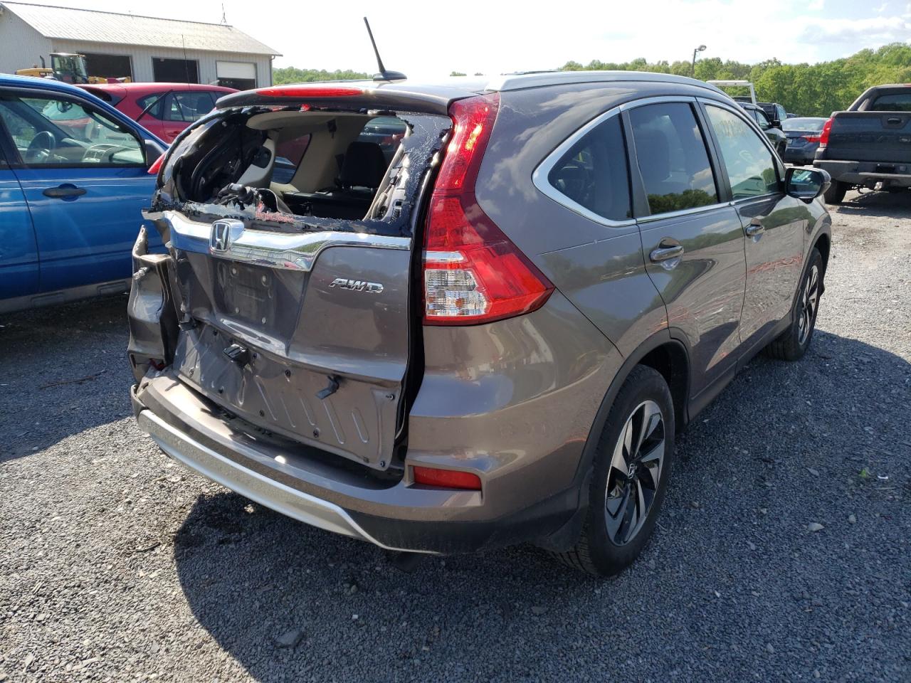 Photo 4 from auction – 2015 HONDA CR-V TOURI with VIN 5J6RM4H97FL063989