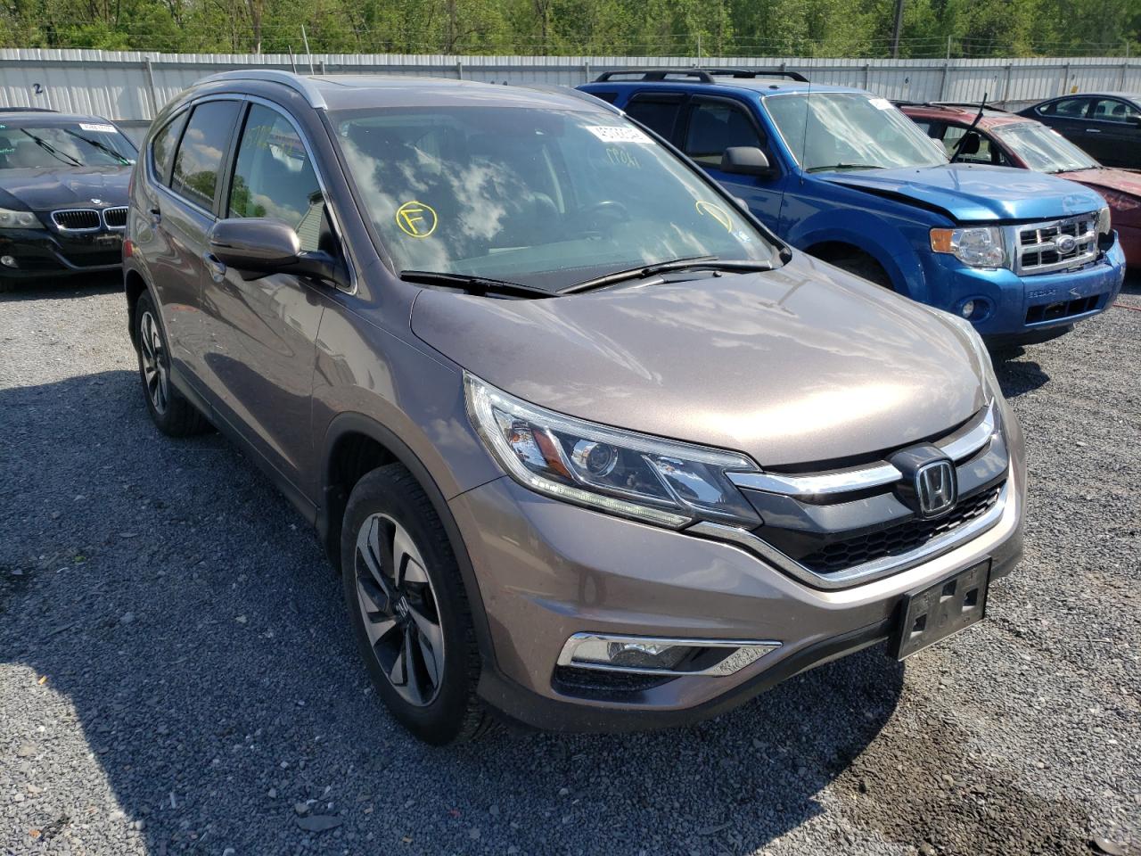 HONDA CR-V TOURI 2015 with VIN 5J6RM4H97FL063989 - Photo from auction