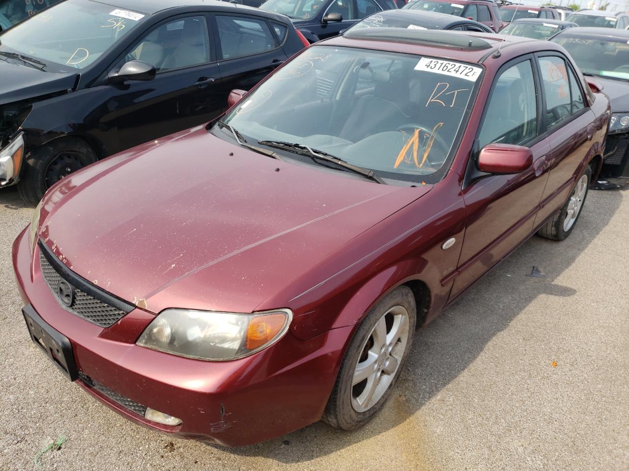 Photo 2 from auction – 2003 MAZDA PROTEGE DX with VIN JM1BJ226631123528