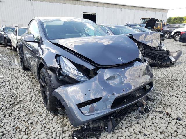TESLA MODEL Y 2022 with VIN 7SAYGAEE0NF308564 - Photo from auction