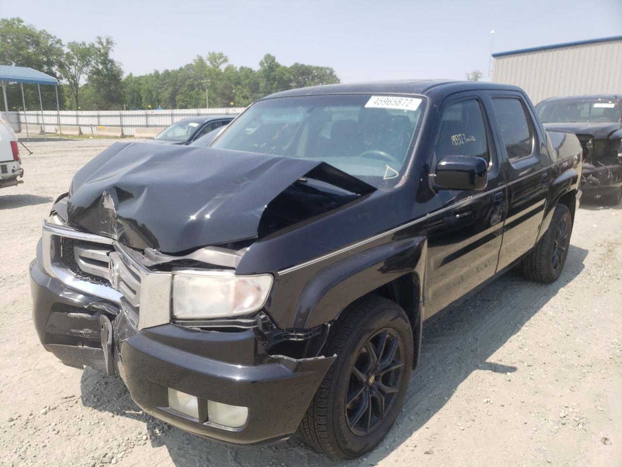 Photo 12 from auction – 2010 HONDA RIDGELINE with VIN 5FPYK1F52AB005717