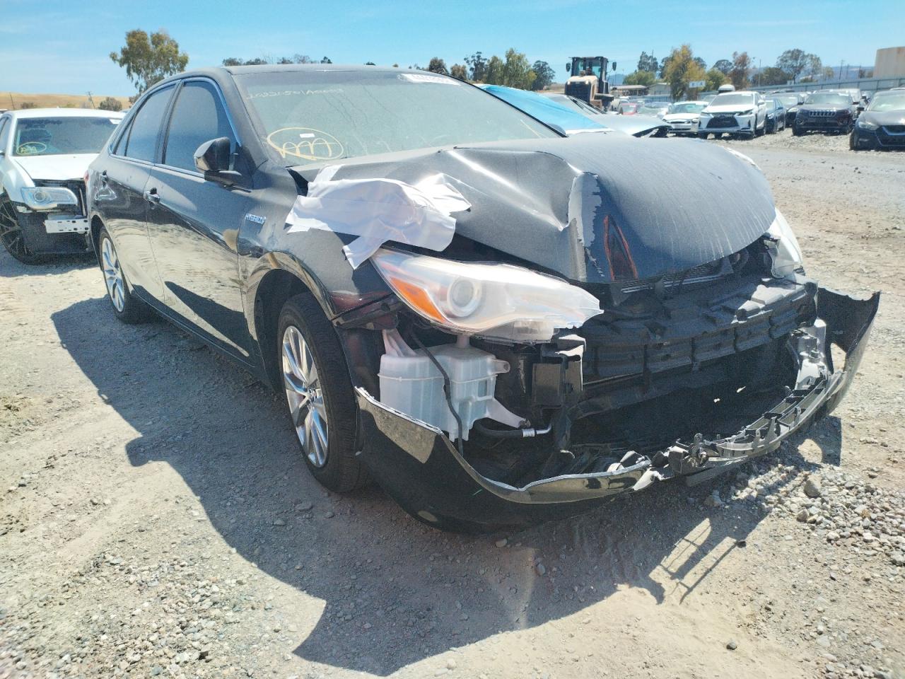TOYOTA CAMRY HYBR 2015 with VIN 4T1BD1FK7FU147294 - Photo from auction