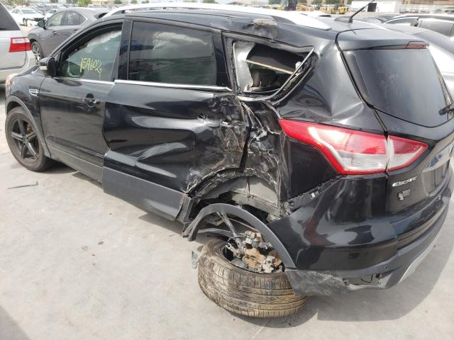 Photo 9 from auction – 2015 FORD ESCAPE TIT with VIN 1FMCU0J95FUA51909