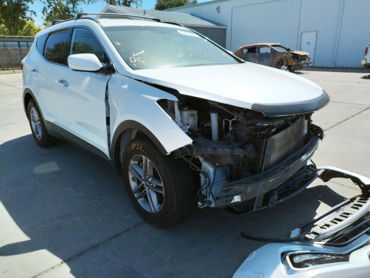 HYUNDAI SANTA FE S 2017 with VIN 5NMZU3LB2HH006338 - Photo from auction