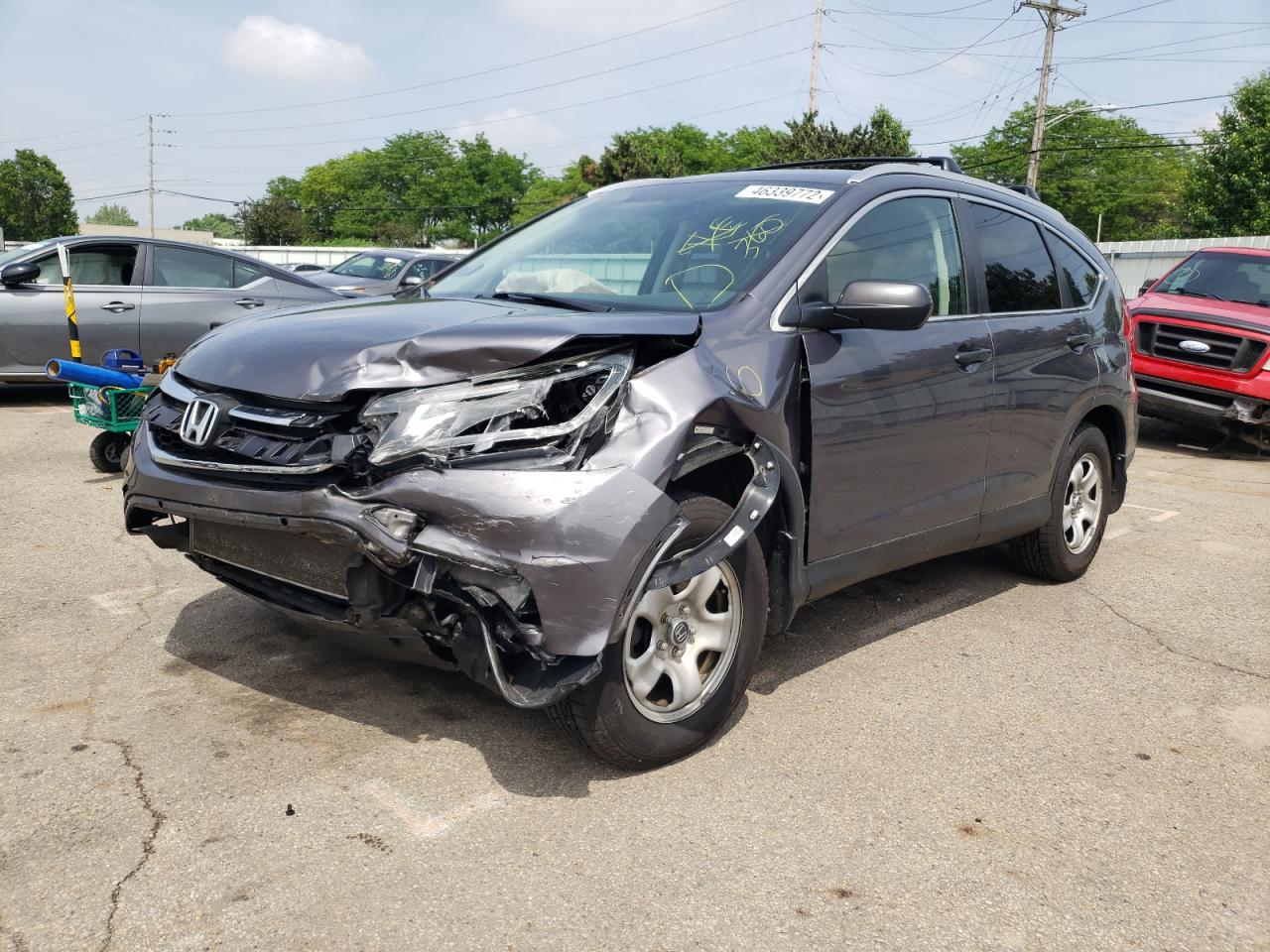 Photo 2 from auction – 2015 HONDA CR-V LX with VIN 5J6RM4H31FL077379