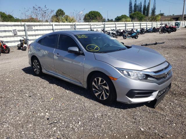 HONDA CIVIC EX 2018 with VIN 19XFC2F76JE025222 - Photo from auction