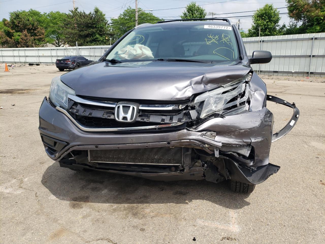 Photo 9 from auction – 2015 HONDA CR-V LX with VIN 5J6RM4H31FL077379