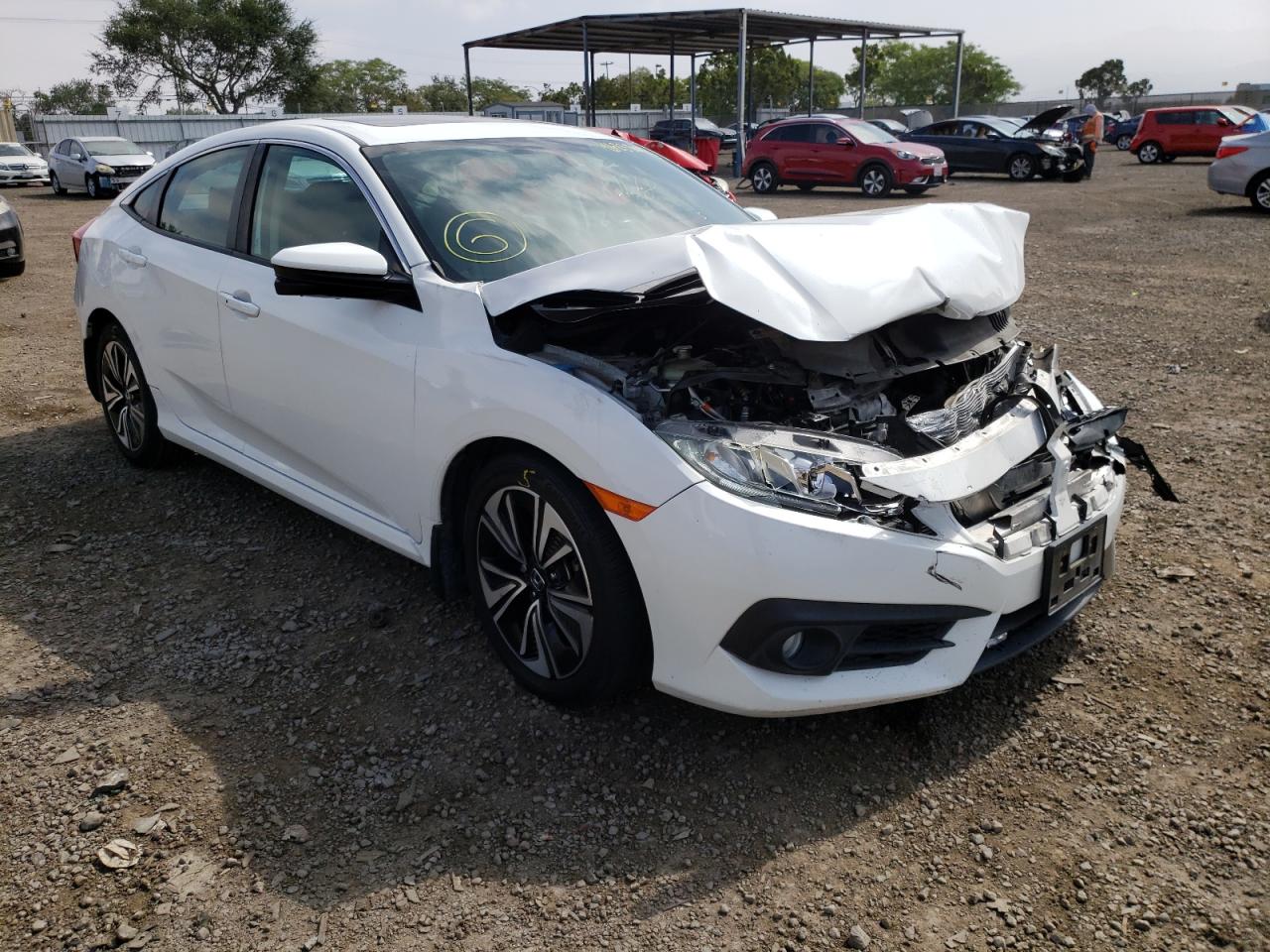 HONDA CIVIC EXL 2016 with VIN 2HGFC1F79GH640954 - Photo from auction