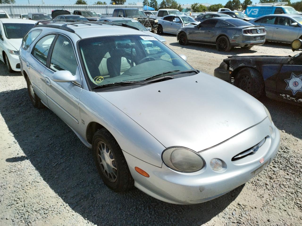 FORD TAURUS SE 1999 with VIN 1FAFP58S7XA297447 - Photo from auction