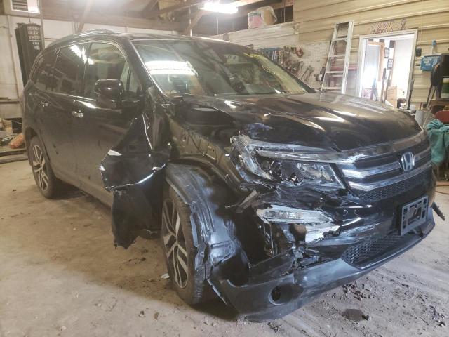 HONDA PILOT TOUR 2017 with VIN 5FNYF6H97HB099730 - Photo from auction