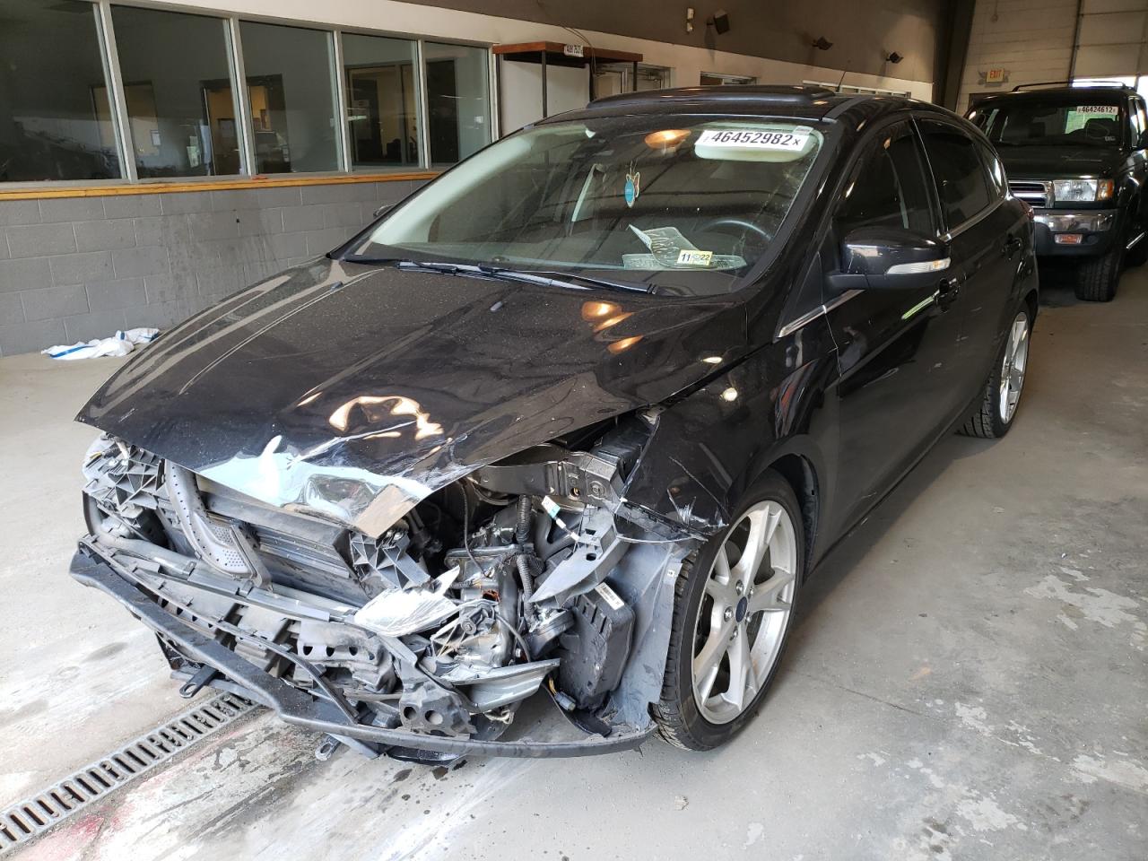 Photo 2 from auction – 2015 FORD FOCUS TITA with VIN 1FADP3N23FL267977