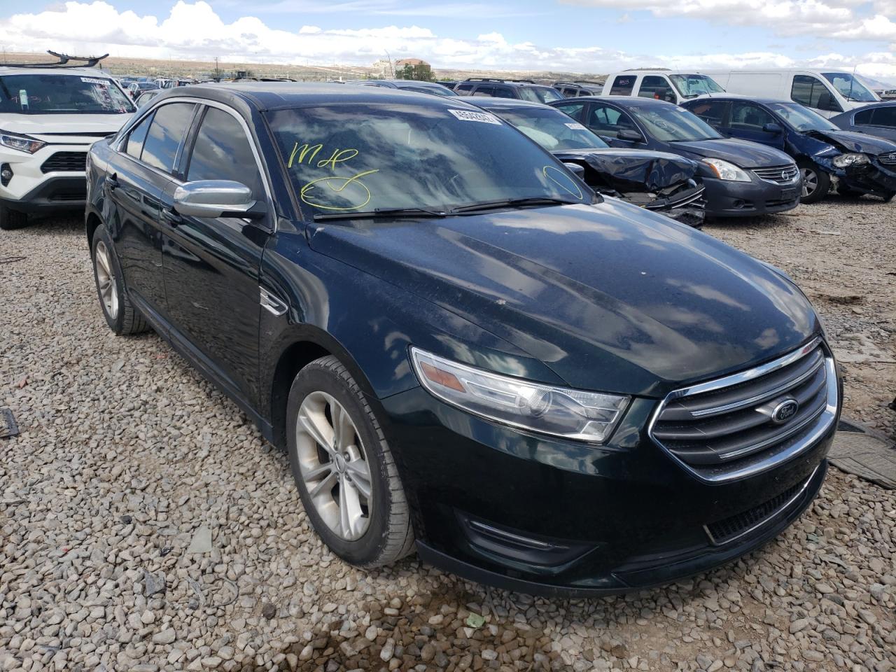 FORD TAURUS SEL 2014 with VIN 1FAHP2H82EG121623 - Photo from auction