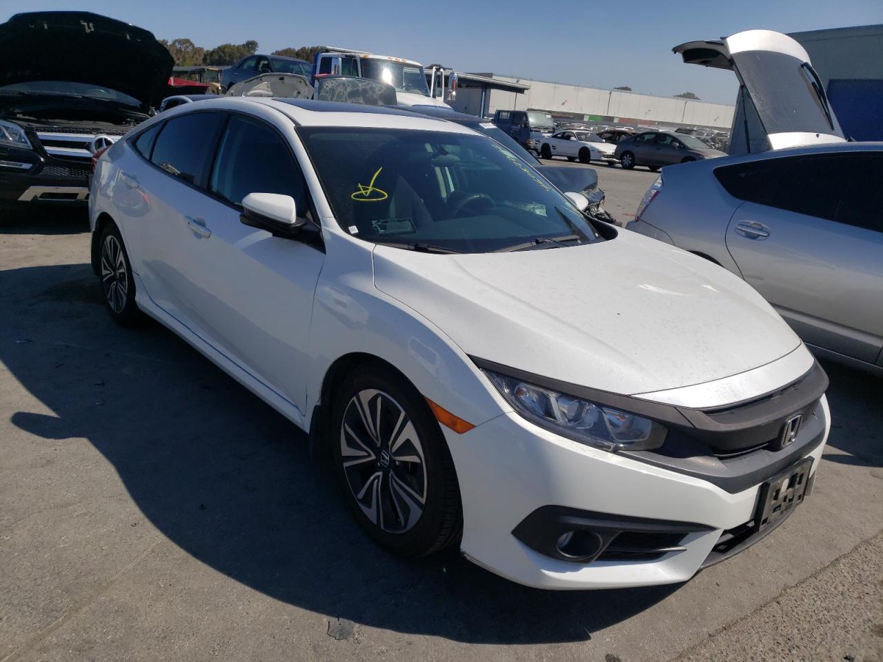 HONDA CIVIC EX 2017 with VIN 2HGFC1F34HH645395 - Photo from auction