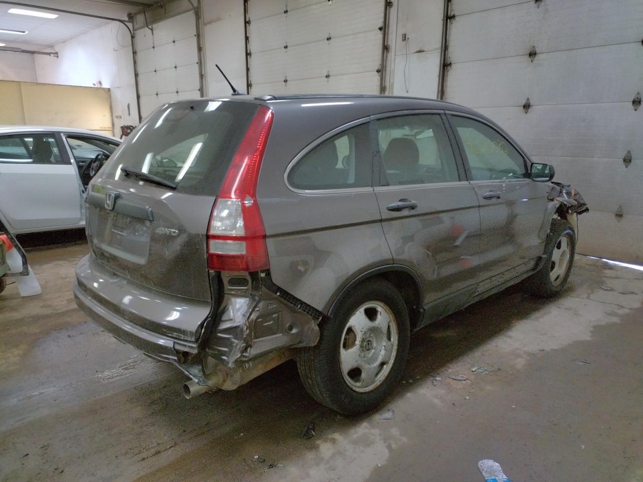 Photo 16 from auction – 2011 HONDA CR-V LX with VIN 5J6RE4H34BL112892