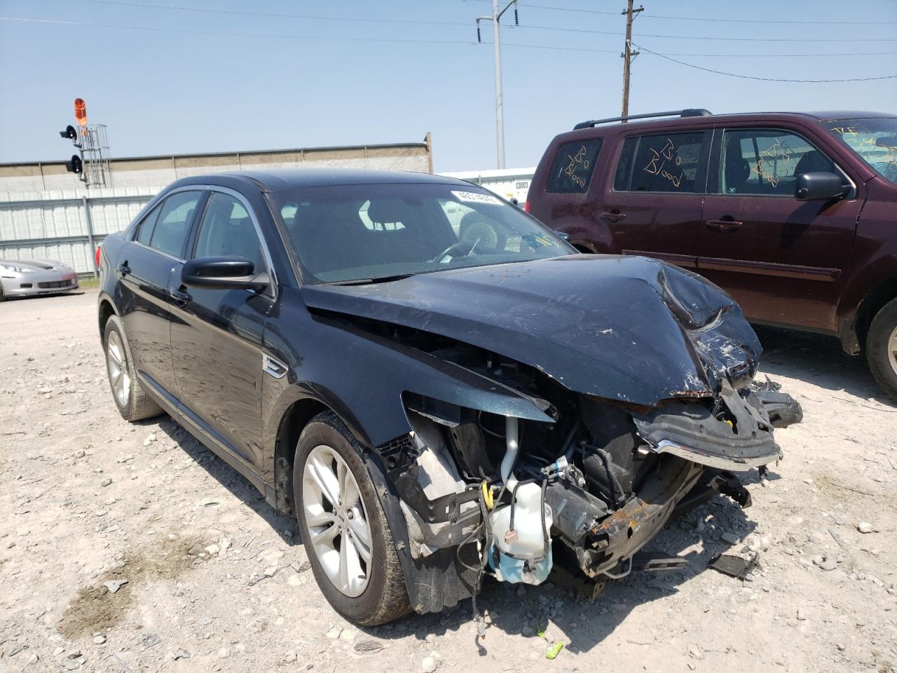 FORD TAURUS SEL 2014 with VIN 1FAHP2E82EG150821 - Photo from auction