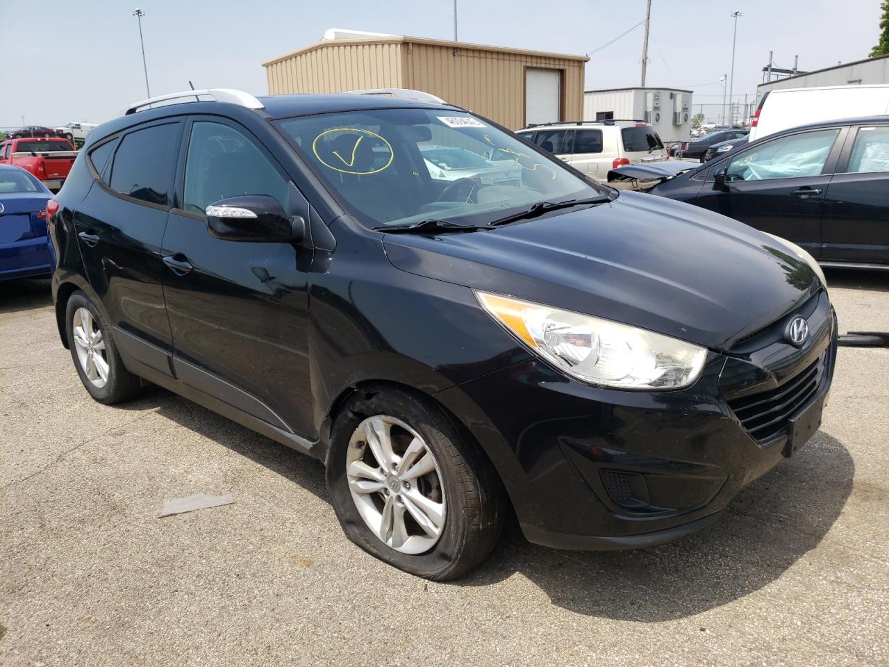 HYUNDAI TUCSON GLS 2012 with VIN KM8JUCAC6CU402438 - Photo from auction