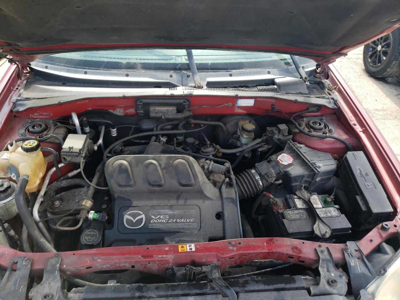 Photo 7 from auction – 2004 MAZDA TRIBUTE LX with VIN 4F2YZ04124KM26939