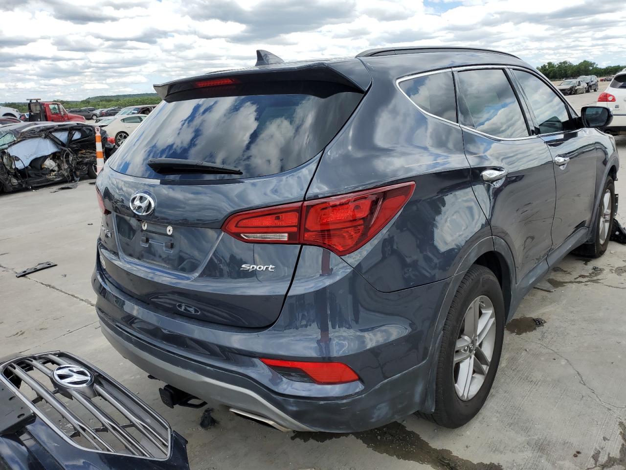 Photo 4 from auction – 2017 HYUNDAI SANTA FE S with VIN 5NMZU3LB1HH025365