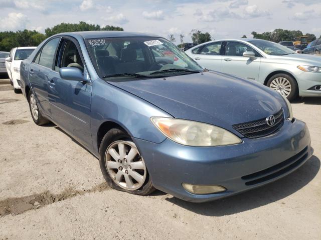 TOYOTA CAMRY LE 2003 with VIN 4T1BF32K73U547637 - Photo from auction