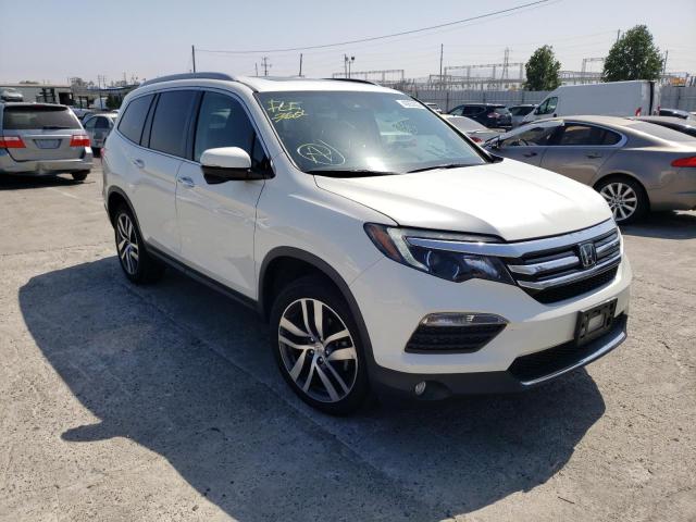 HONDA PILOT TOUR 2017 with VIN 5FNYF5H9XHB033649 - Photo from auction