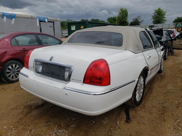 Photo 4 from auction – 2004 LINCOLN TOWN CAR E with VIN 1LNHM81W54Y687861