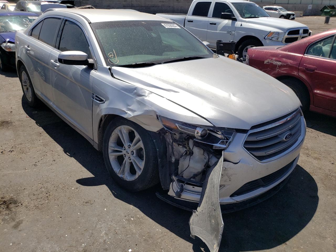 FORD TAURUS SEL 2016 with VIN 1FAHP2H8XGG104765 - Photo from auction