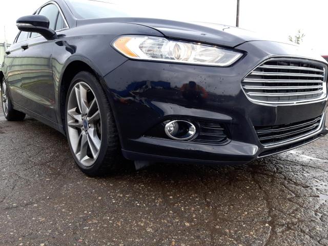 FORD FUSION TIT 2016 with VIN 3FA6P0D99GR206044 - Photo from auction