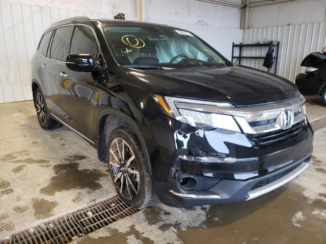 HONDA PILOT TOUR 2019 with VIN 5FNYF5H69KB043280 - Photo from auction
