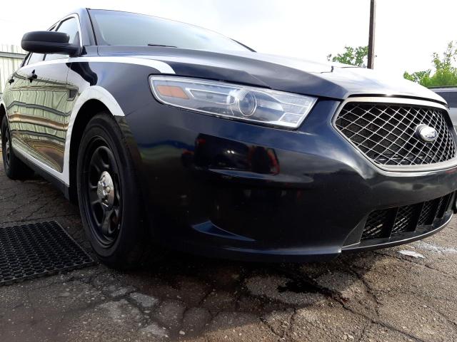 FORD TAURUS POL 2013 with VIN 1FAHP2M81DG104073 - Photo from auction