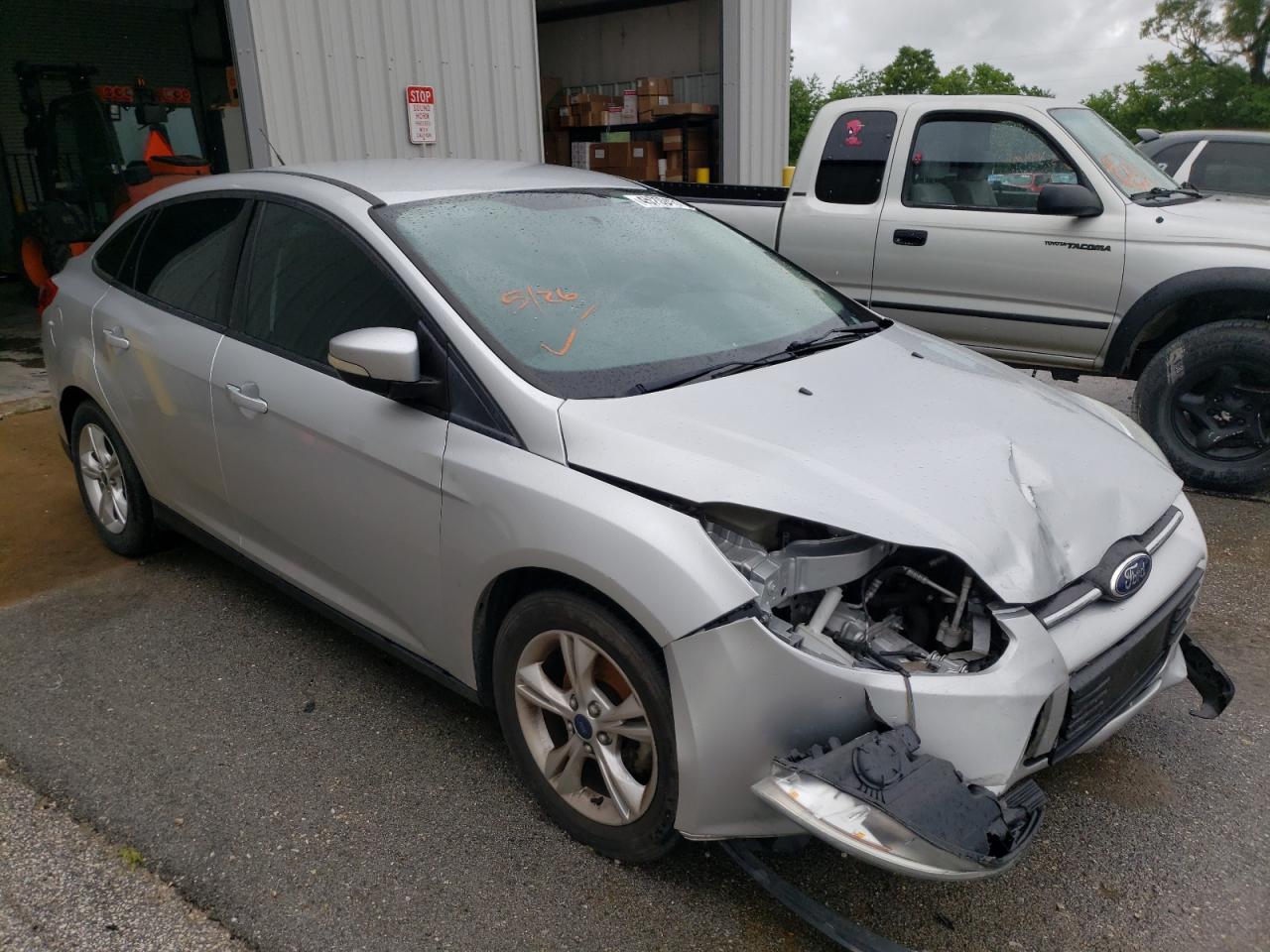 FORD FOCUS SE 2014 with VIN 1FADP3F21EL373194 - Photo from auction