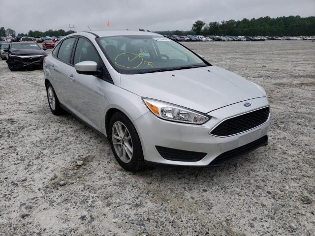 FORD FOCUS SE 2018 with VIN 1FADP3F29JL299047 - Photo from auction
