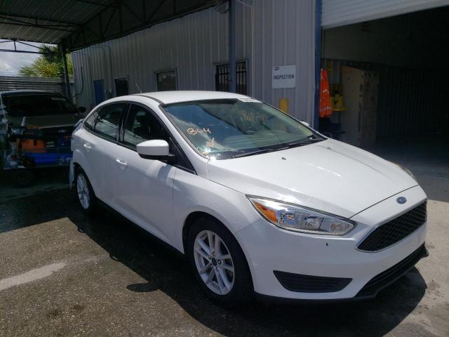 FORD FOCUS SE 2018 with VIN 1FADP3FE2JL220523 - Photo from auction