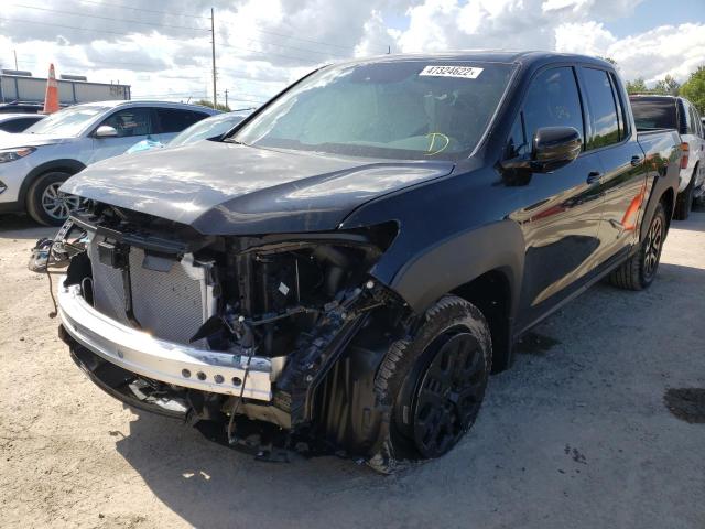 Photo 2 from auction – 2022 HONDA RIDGELINE with VIN 5FPYK3F84NB018688