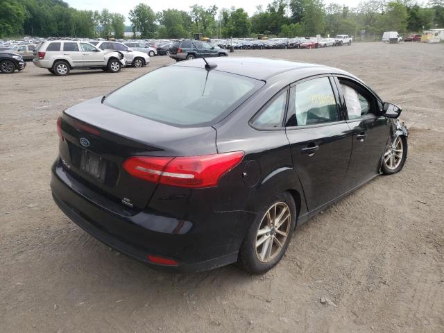 Photo 4 from auction – 2017 FORD FOCUS SE with VIN 1FADP3FE5HL330590