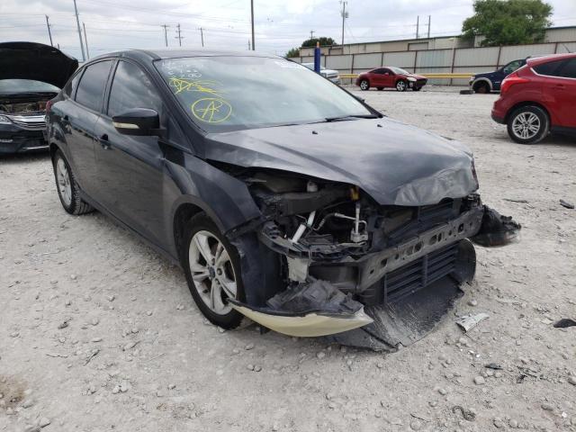 FORD FOCUS SE 2014 with VIN 1FADP3F20EL390519 - Photo from auction