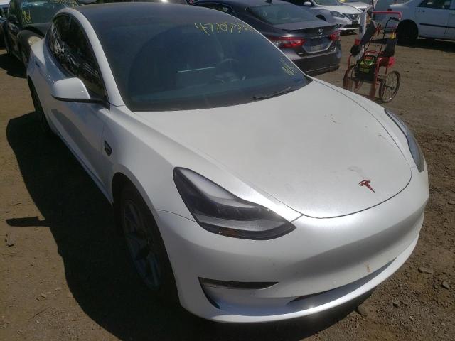 TESLA MODEL 3 2021 with VIN 5YJ3E1EAXMF976820 - Photo from auction