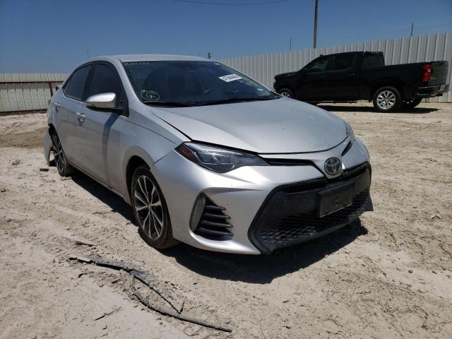 TOYOTA COROLLA L 2018 with VIN 5YFBURHE5JP810121 - Photo from auction