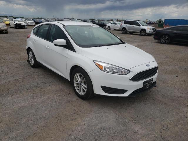 FORD FOCUS SE 2018 with VIN 1FADP3K27JL331077 - Photo from auction