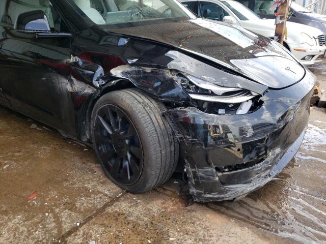 Photo 9 from auction – 2021 TESLA MODEL Y with VIN 5YJYGDEEXMF257877