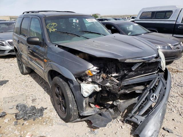MAZDA TRIBUTE LX 2002 with VIN 4F2YU09142KM42032 - Photo from auction