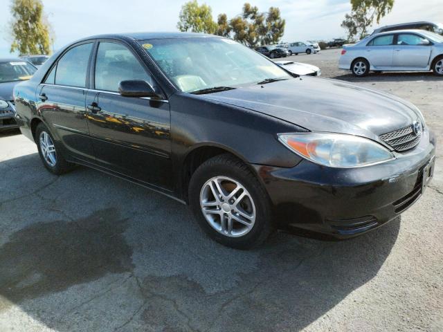TOYOTA CAMRY LE 2002 with VIN JTDBE32K520029779 - Photo from auction