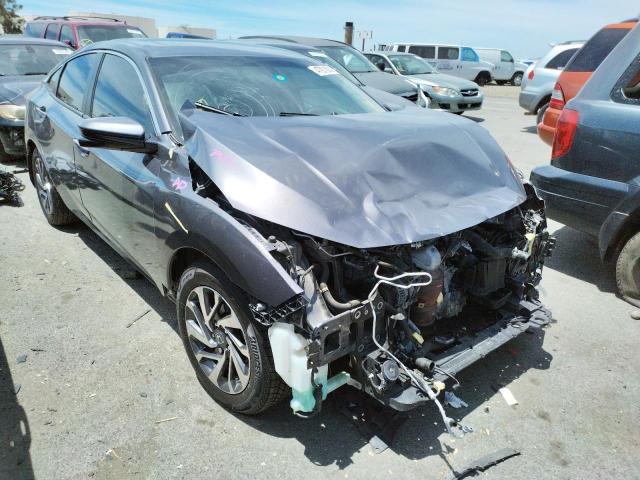 HONDA CIVIC EX 2018 with VIN 19XFC2F74JE011271 - Photo from auction