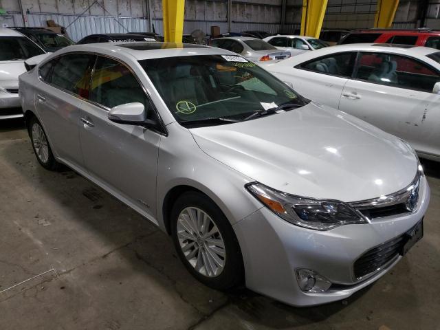TOYOTA AVALON HYB 2014 with VIN 4T1BD1EB2EU031128 - Photo from auction
