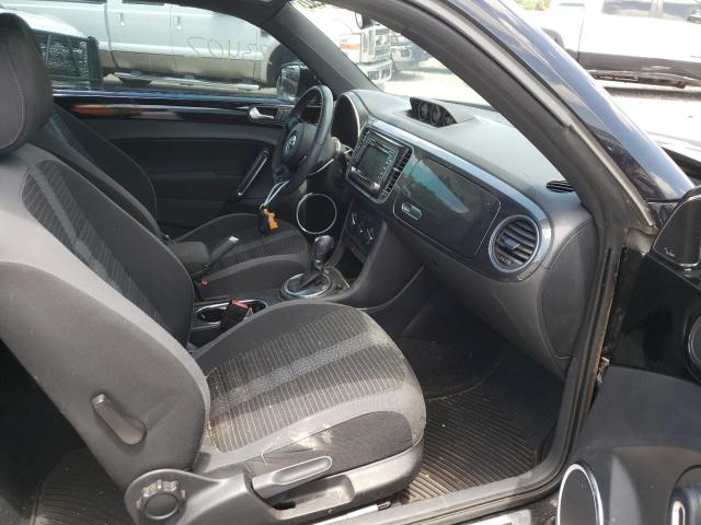 Photo 5 from auction – 2014 VOLKSWAGEN BEETLE TUR with VIN 3VWVS7AT7EM604910