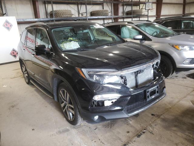 HONDA PILOT TOUR 2017 with VIN 5FNYF6H97HB064279 - Photo from auction