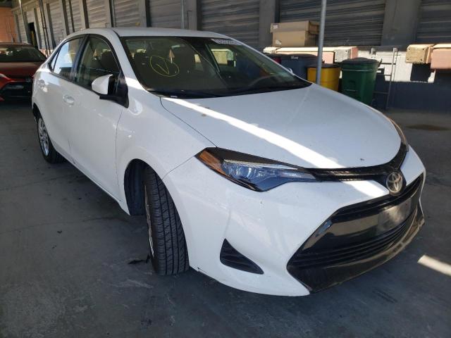 TOYOTA COROLLA L 2019 with VIN 5YFBURHE9KP899418 - Photo from auction