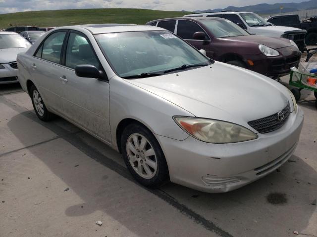 TOYOTA CAMRY LE 2002 with VIN 4T1BF30K72U520228 - Photo from auction