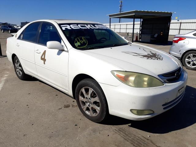 TOYOTA CAMRY LE 2004 with VIN JTDBE32K640283181 - Photo from auction