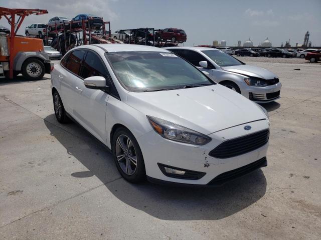 FORD FOCUS SE 2018 with VIN 1FADP3F22JL200990 - Photo from auction